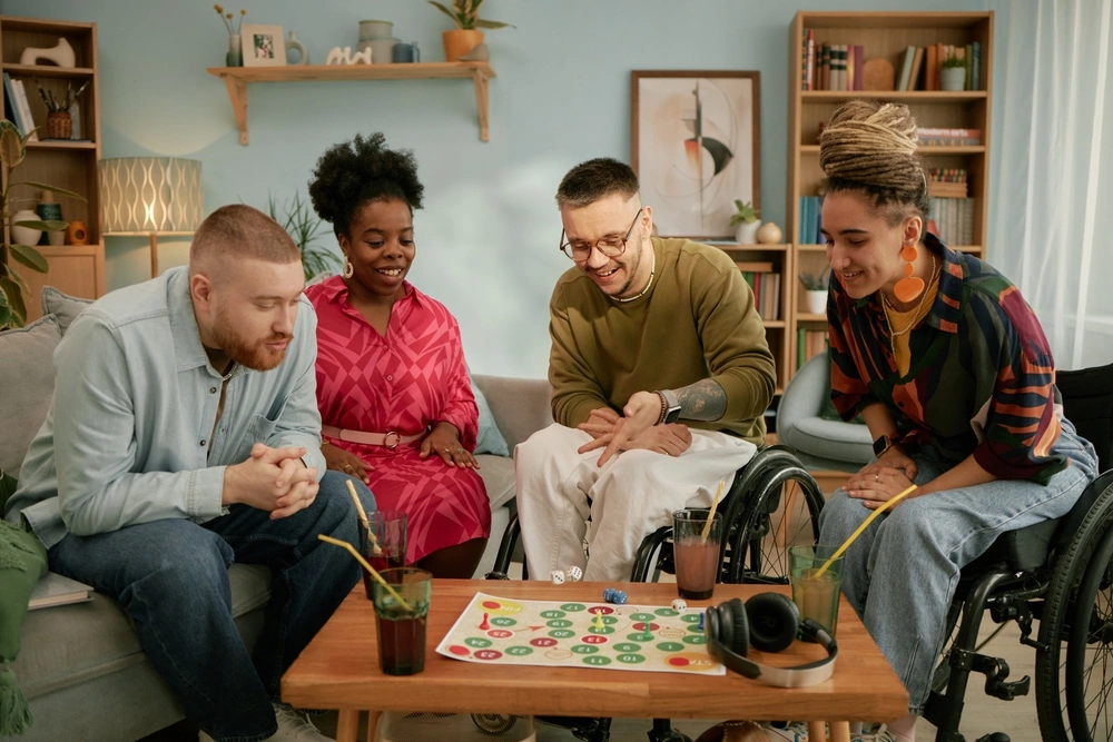 group of friends with disabilities playing board games